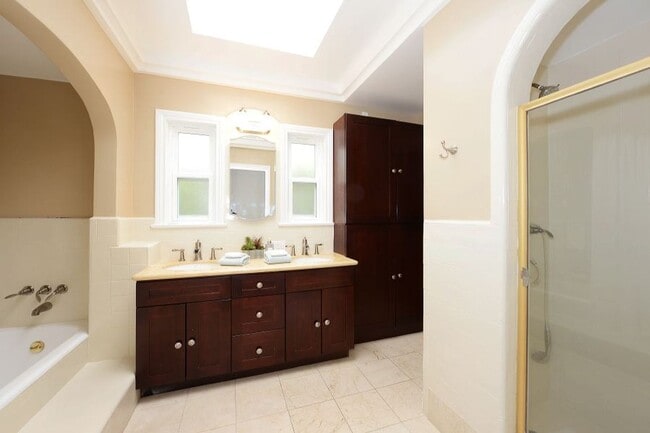 Building Photo - Welcome to this beautifully updated Spanis...