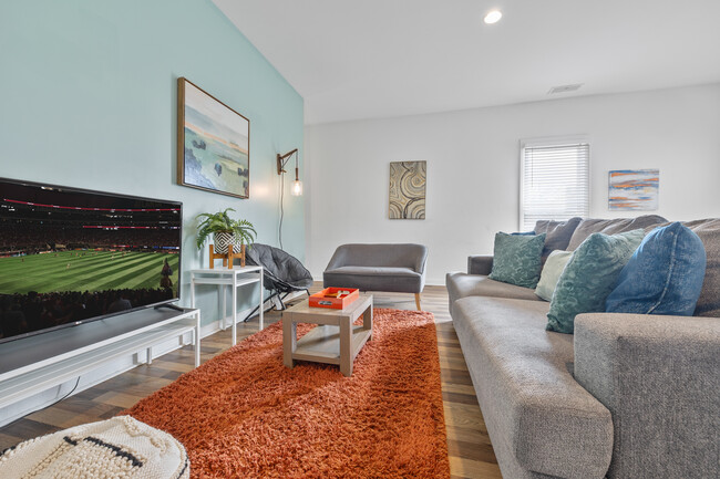 Open living room with lots of comfy seating & smart TV for entertainment - 906 Allene Ave SW