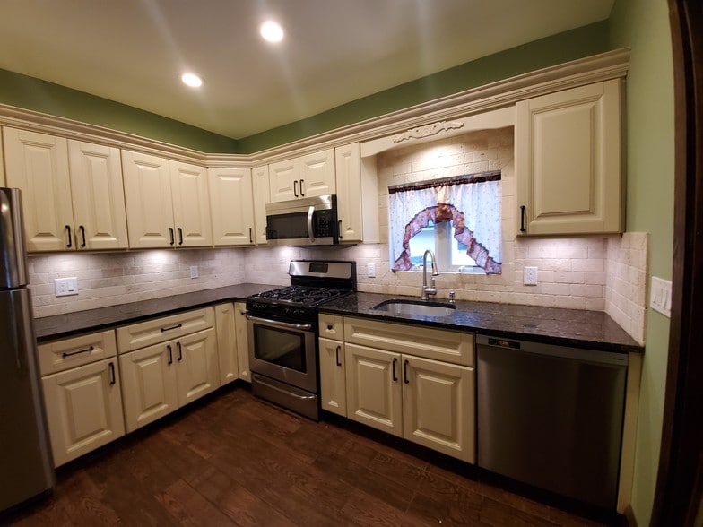 Stainless steel fridge stove dishwasher sink - 78 S Carll Ave