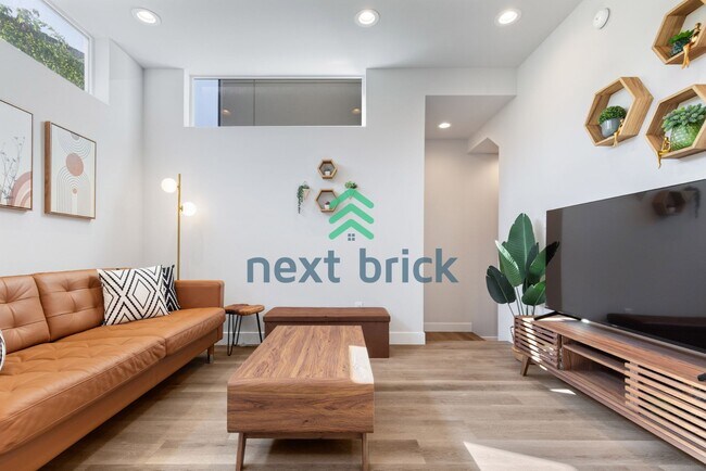 Building Photo - Offer: Unfurnished option available at $3,250, with an optional furnished package for an addition...