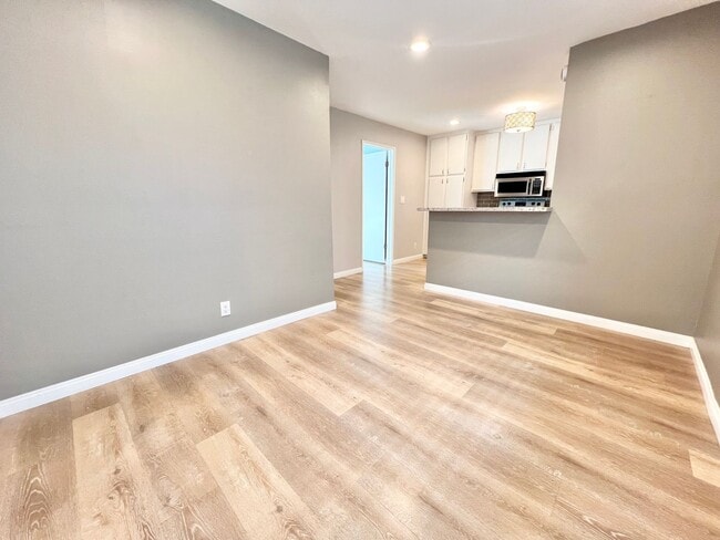 Building Photo - Contemporary 2 Bed Condo with 2 Garage Parking Spaces, Community Pool, and 3 Private Balconies