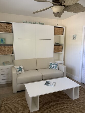 Couch with Murphy bed that pulls down over couch and table - 3203 NE 5th St