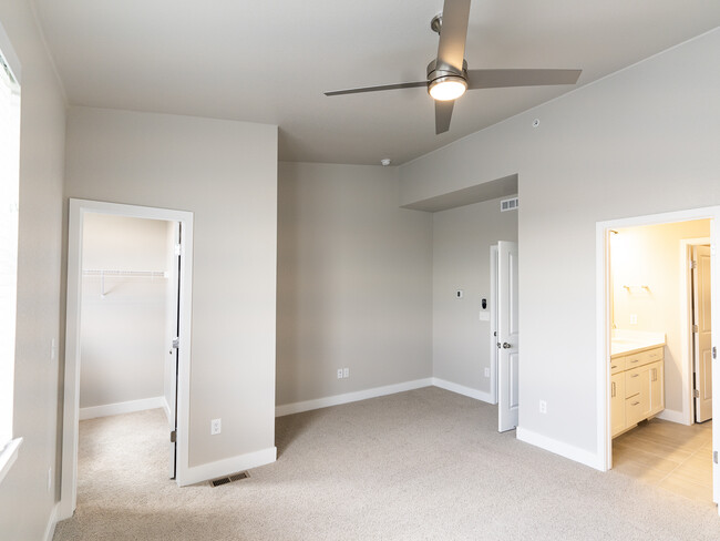 Larger bedroom, vaulted ceiling, walk in closet (top level) - 2863 W 69th Ave