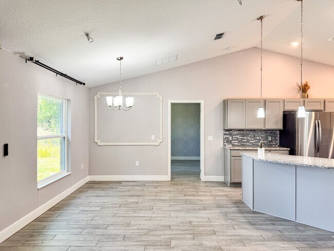 Building Photo - LAKE FRONT BRAND NEW Beautiful 3 bedroom on Lake Toho!