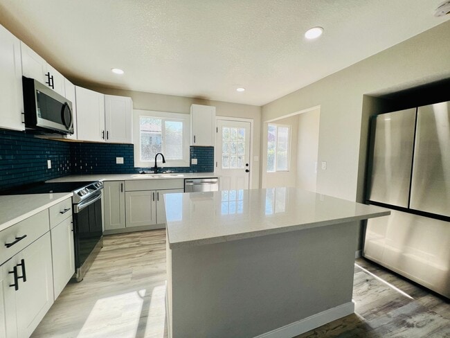 Building Photo - $0 DEPOSIT OPTION,FULLY REMODELED RANCH GEM OFF SHERIDAN, CLOSE TO SLOAN LAKE!