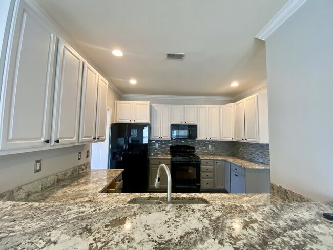 Building Photo - Three Bedroom Home with fenced-in Backyard oasis!