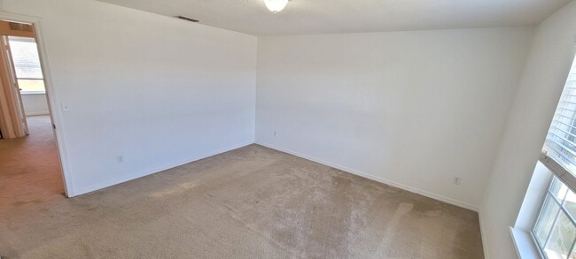 Building Photo - Spacious 3/3 townhome + attached 2-car gar...