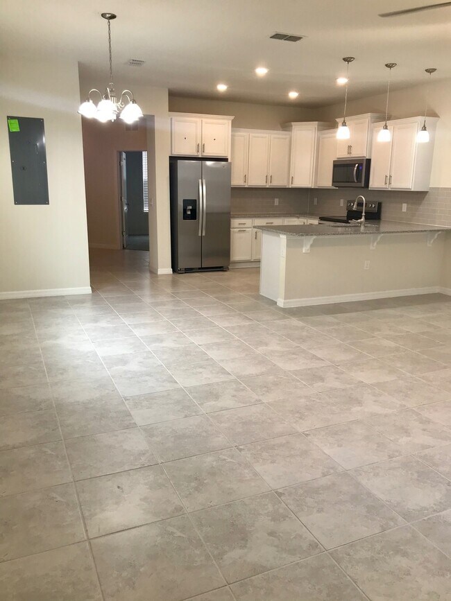 Building Photo - MOVE IN SPECIAL- Energy Efficient 3/3 Townhome w/ 2 Car Garage Near Lake Nona