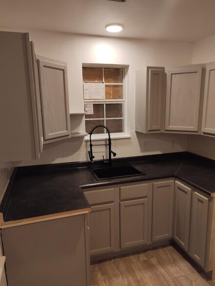 Updated kitchen with new fixtures and cabinets - 1819 Wells Station Rd