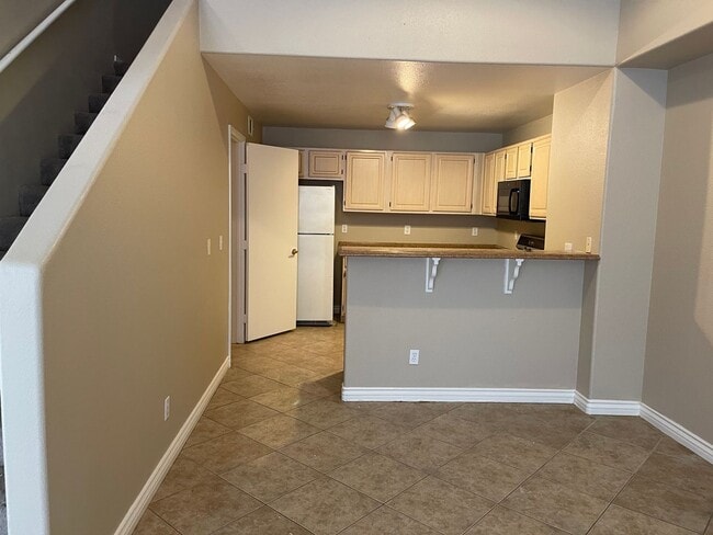 Building Photo - Spacious Condo with Loft & 2-Car Garage – Minutes from the Strip!