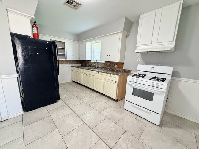 Building Photo - Affordable 3BR Brick Home with Carport