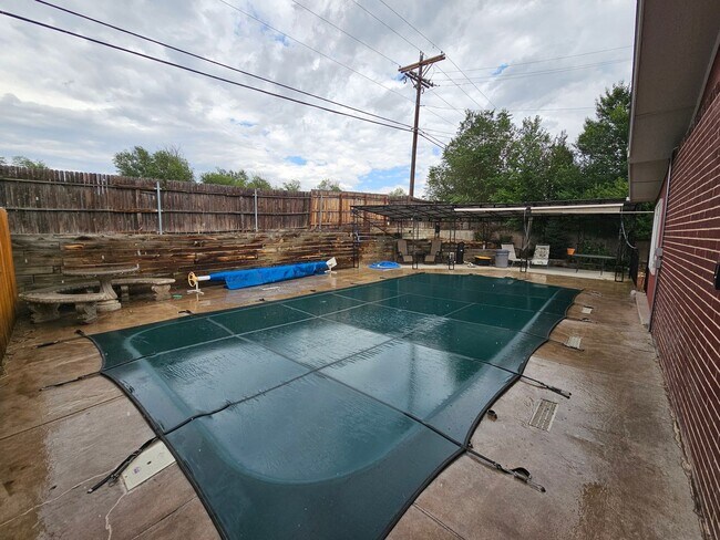 Building Photo - 4-Bedroom Home with In-Ground Pool, Solar ...