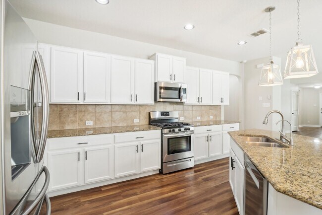 Building Photo - "Charming 4-Bedroom Oasis with custom fini...