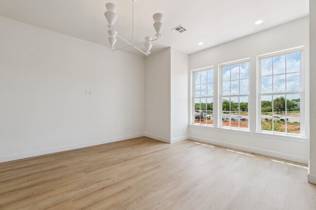 Building Photo - Bright. Clean. Calm. Your Elevated One-Bed...