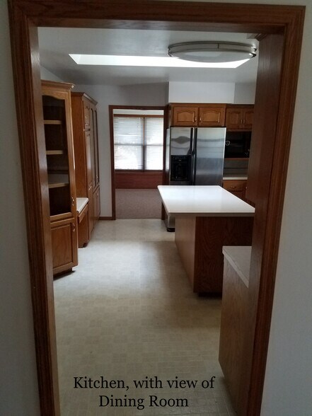 Kitchen w view into Dining Room - 1010 N Gammon Rd