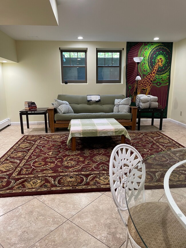 Living room with Futon ( full size bed ). - 472 Yaphank Middle Island Rd