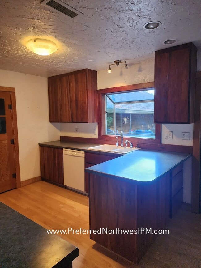Building Photo - Beautiful home on 2 organically-landscape ...