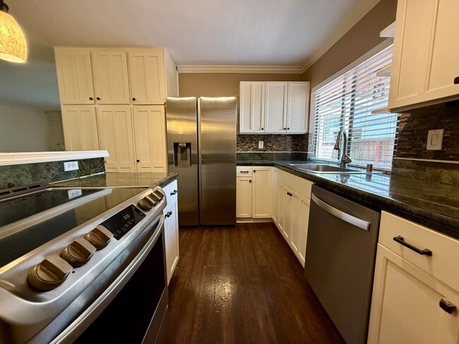 Building Photo - Spacious & Stylish Mission Plymor Townhome! 2 Assigned Parking! AC!