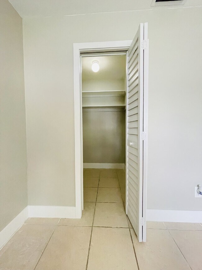 Building Photo - Updated 2-bedroom waterfront duplex with walk-in closets, enclosed Florida room, and canal views ...