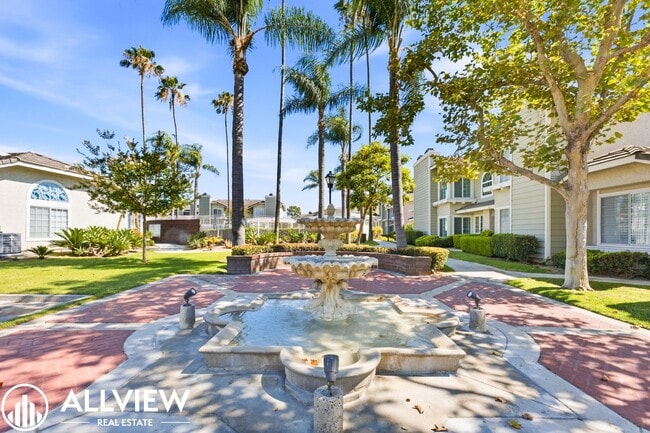 Building Photo - Fully Renovated 2 Bed Townhome with Private Patio, 2-Car Garage & Community Pool