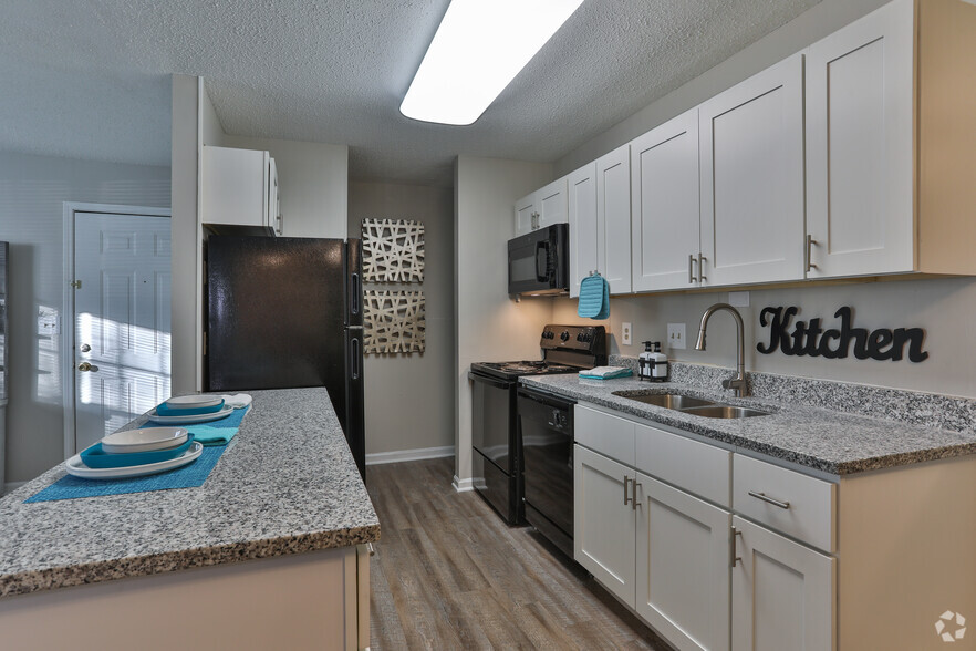 Newly Renovated Kitchen-Granite Counter Tops, Black Appliances, and New Cabinets! - Windsor Palms Apartment Homes