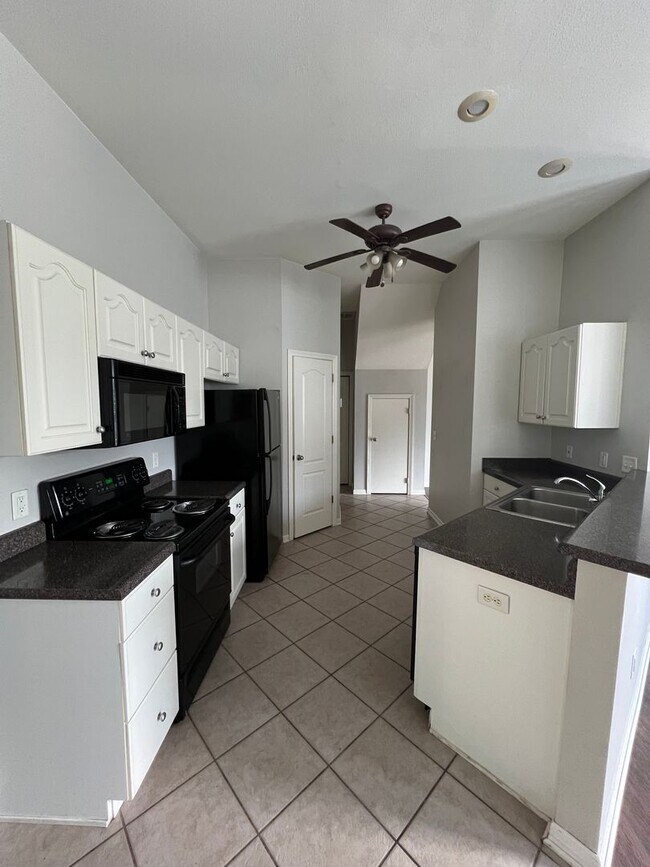 Building Photo - Three Bed / Three Bath with Fenced Yard and Community Pool