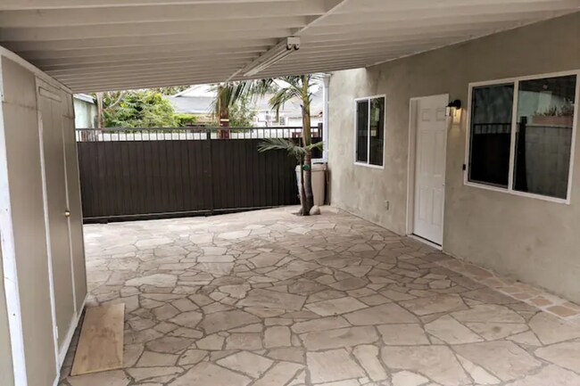 Sliding Gate that leads to unit - 1253 W 51st Plz