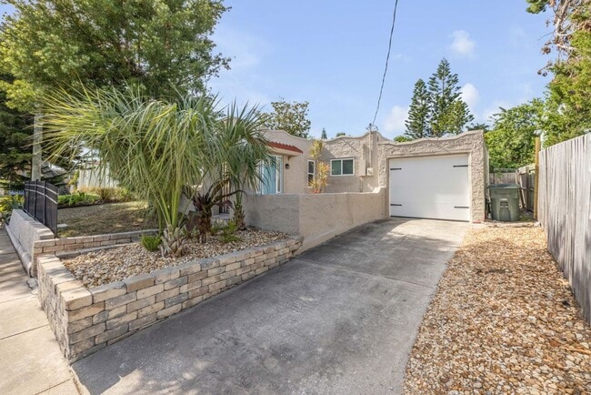 Building Photo - Renovated Spanish-Style 2/1 Beach Bungalow...