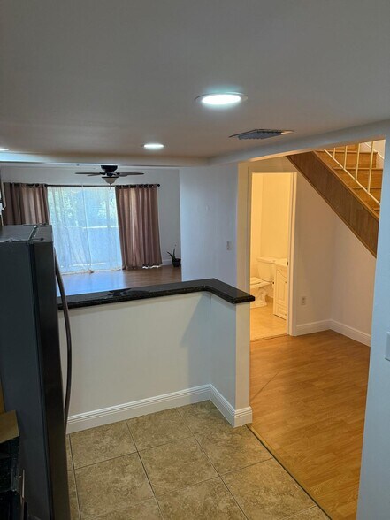 Kitchen looking into living room and guest bathroom - 9365 Fontainebleau Blvd