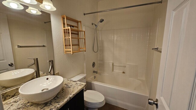 Building Photo - Partially Furnished 2/2 CONDO WITH  *BONUS DEN* & 2 CAR GARAGE!