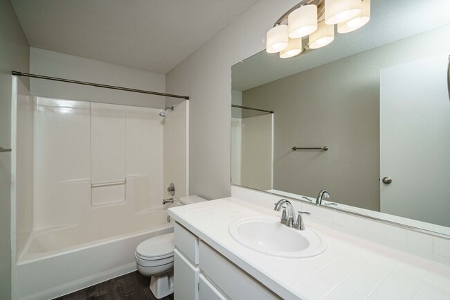 Building Photo - Recently Updated with Wood Laminate Flooring and Fresh Paint