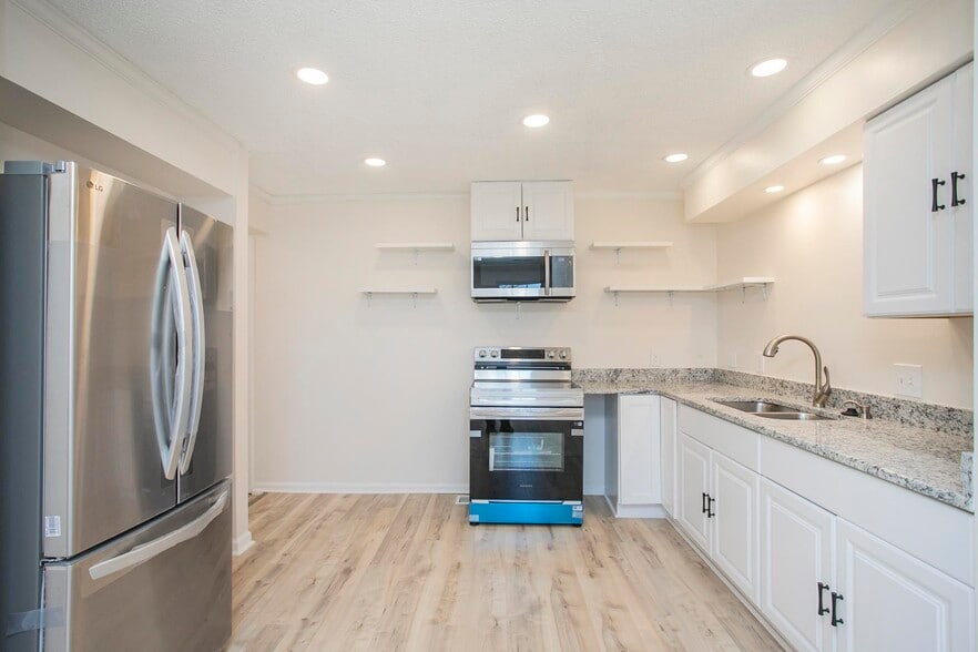 The space offers ample cabinetry and generous counter space, making it both functional and stylish f - 105 Jacksons Retreat Ct