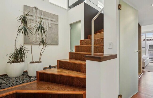 Building Photo - One-of-a-Kind Sophisticated Top-Floor Cond...