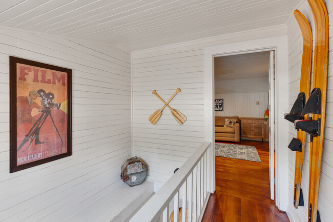 Upstairs decor and entrance to upstairs bunk room. - 717 E Lakeside Ave