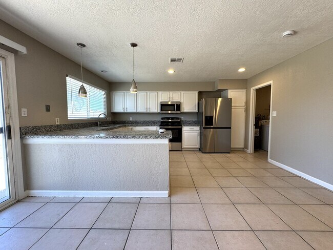 Building Photo - CORNER LOT 3 BEDROOM PLUS DEN WITH FIREPLACE AND LARGE YARD