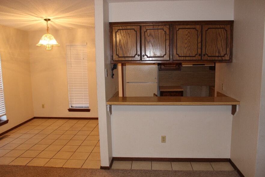 Kitchen and Bar view from Living Room - 908 Acacia Cir