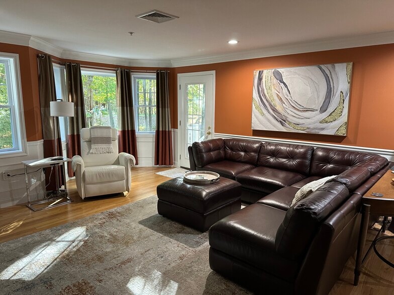 Living area with door to deck and yard - 4 Sterling Hill Ln