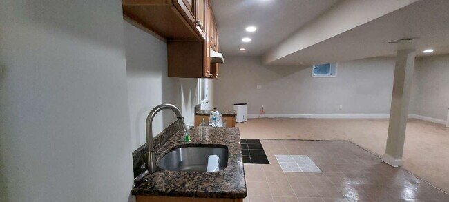 Building Photo - "Expansive 5-Bedroom Haven with Dual Kitch...