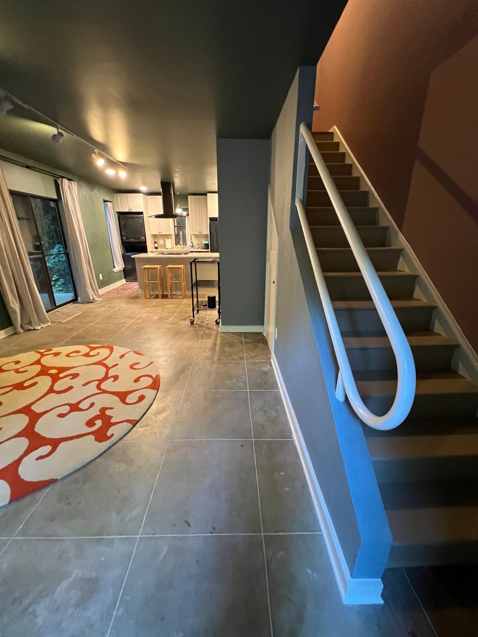 living area, kitchen from stairs - 130 E Longview St