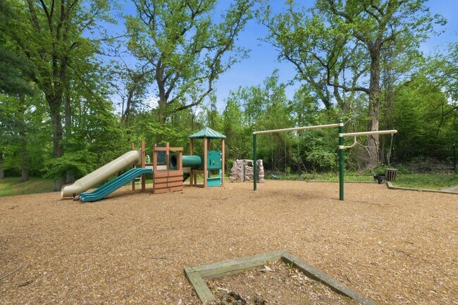 Building Photo - This expansive ground level residence is set within a serene, gated garden community surrounded b...