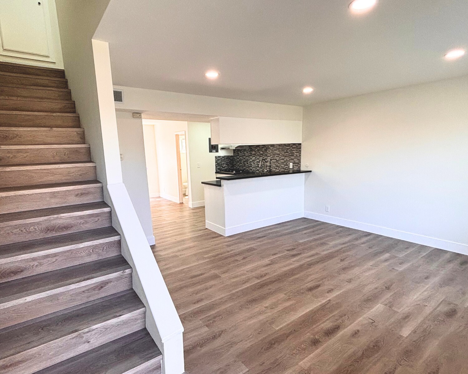 Main Living Space & Stair Case - 1002 Mission Dr