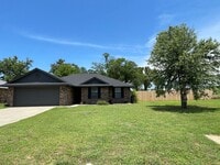 Building Photo - Fenced yard/Storage building/Close to college/Paved street