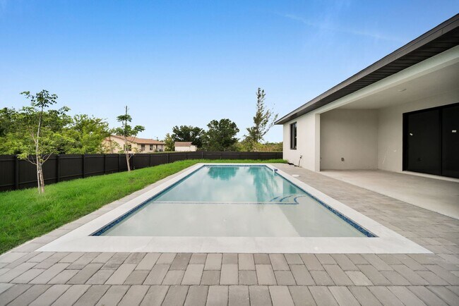 Building Photo - Brand-New Pool Home for Rent – Port Charlo...
