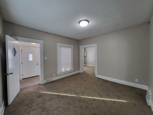 Building Photo - Two bedroom home with partially fenced yard!