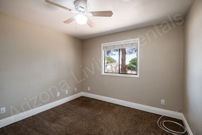 Building Photo - LARGE FENCED YARD WITH DETACHED GARAGE