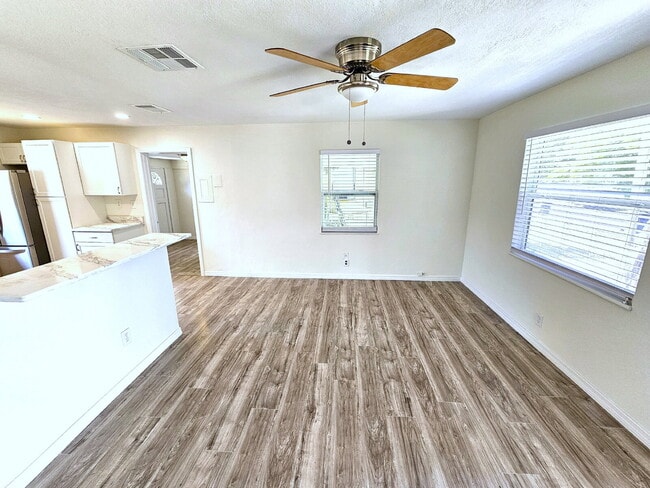 Building Photo - fully renovated 2-bedroom, 1-bathroom home with bonus guest room or office and oversized fenced yard