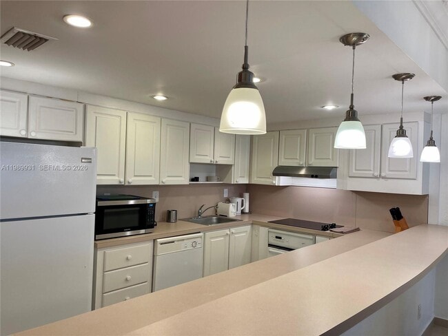 Building Photo - 19390 Collins Ave