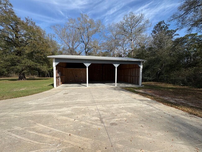 Building Photo - Available Now: Expansive 4BR Home with Rare 3-Bay Carport