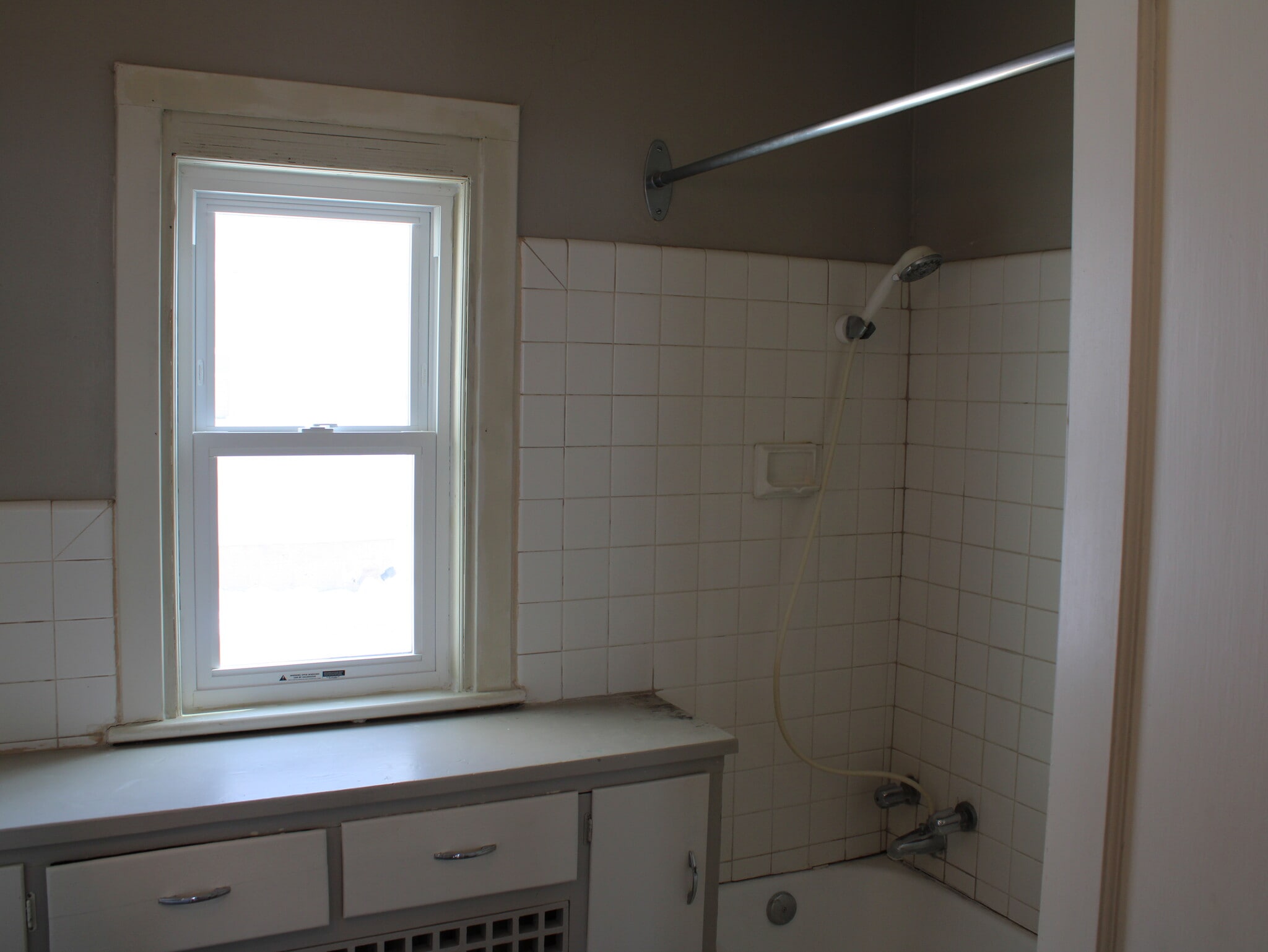 Bathroom with tile shower. - 28 5th St