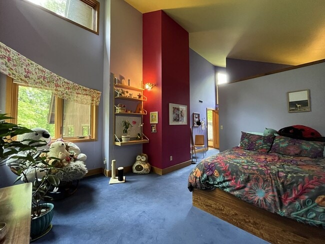 Building Photo - One-of-a-Kind Custom Home with Wall of Windows, Stone Fireplaces, Expansive Entertainment Space &...